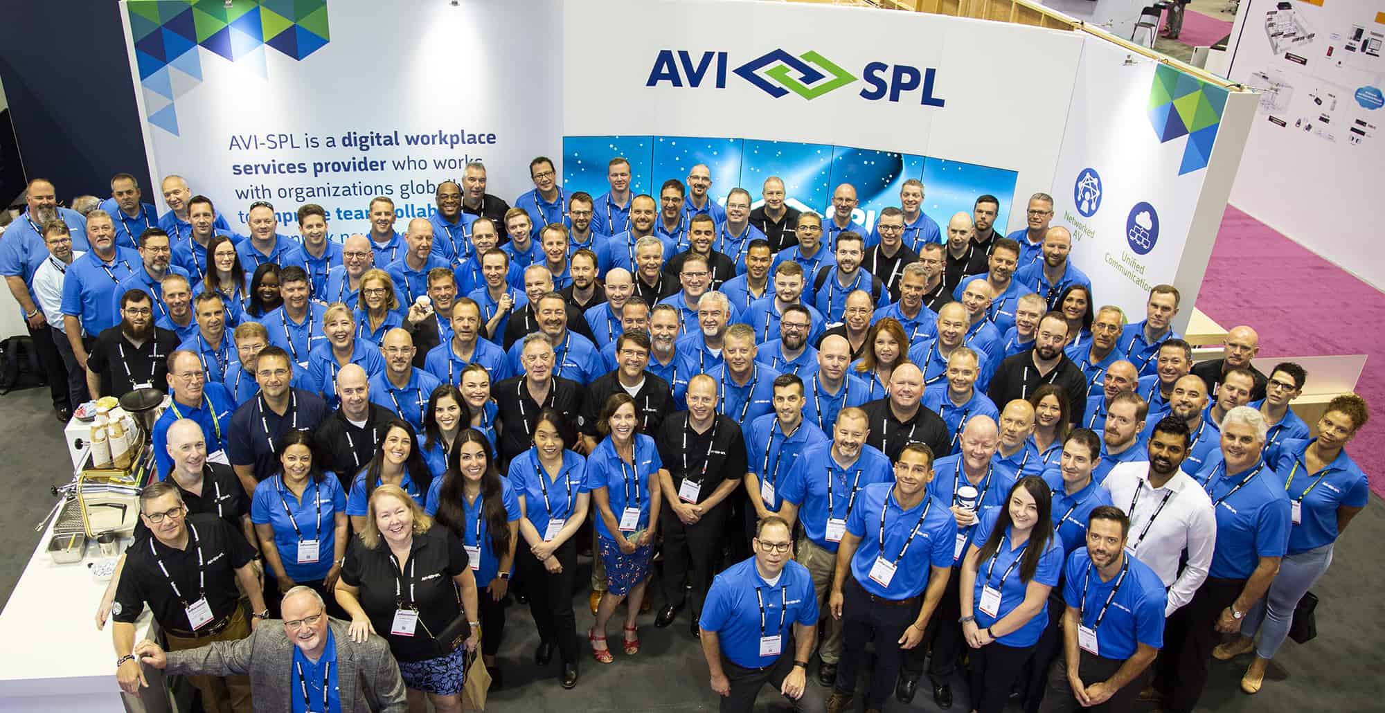 group of AVI-SPL employees at trade show