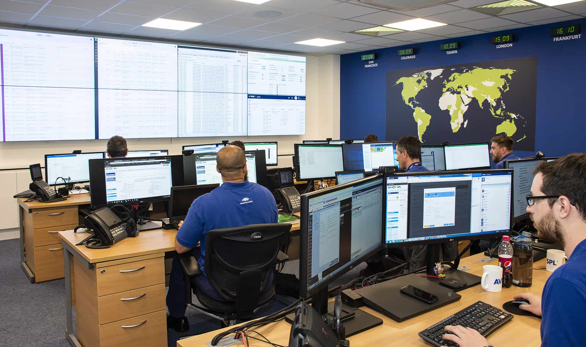 global support staff monitoring global technology deployment