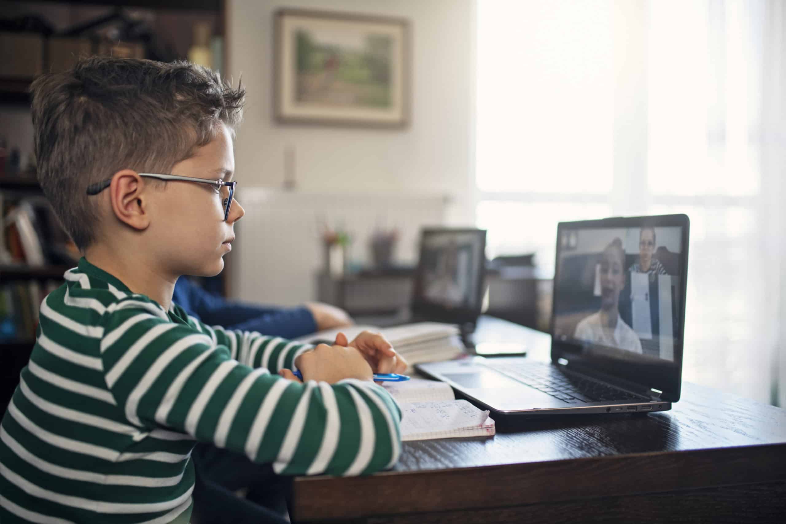 k-12 student using laptop for virtual class distance learning