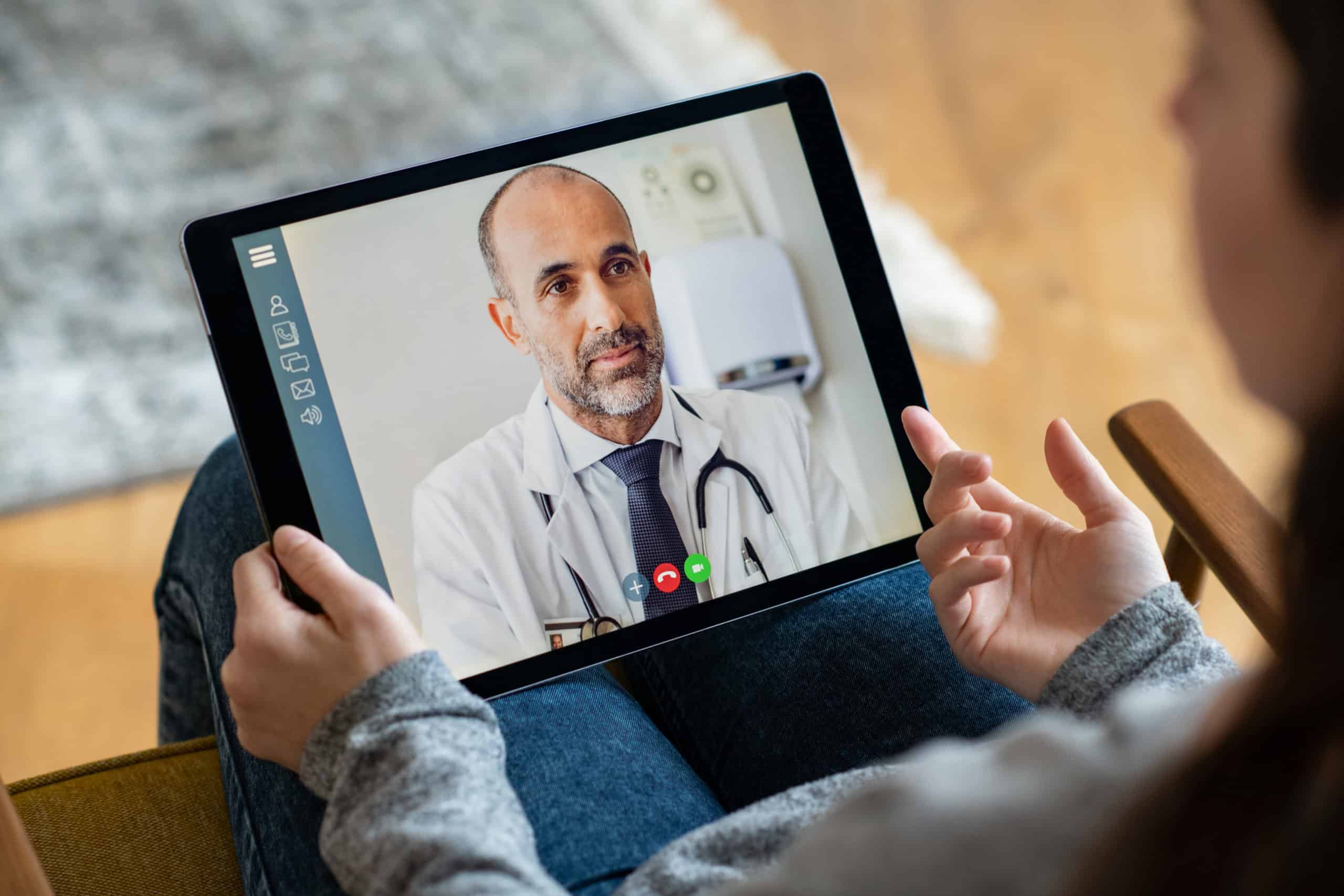 patient using tablet for telehealth appointment