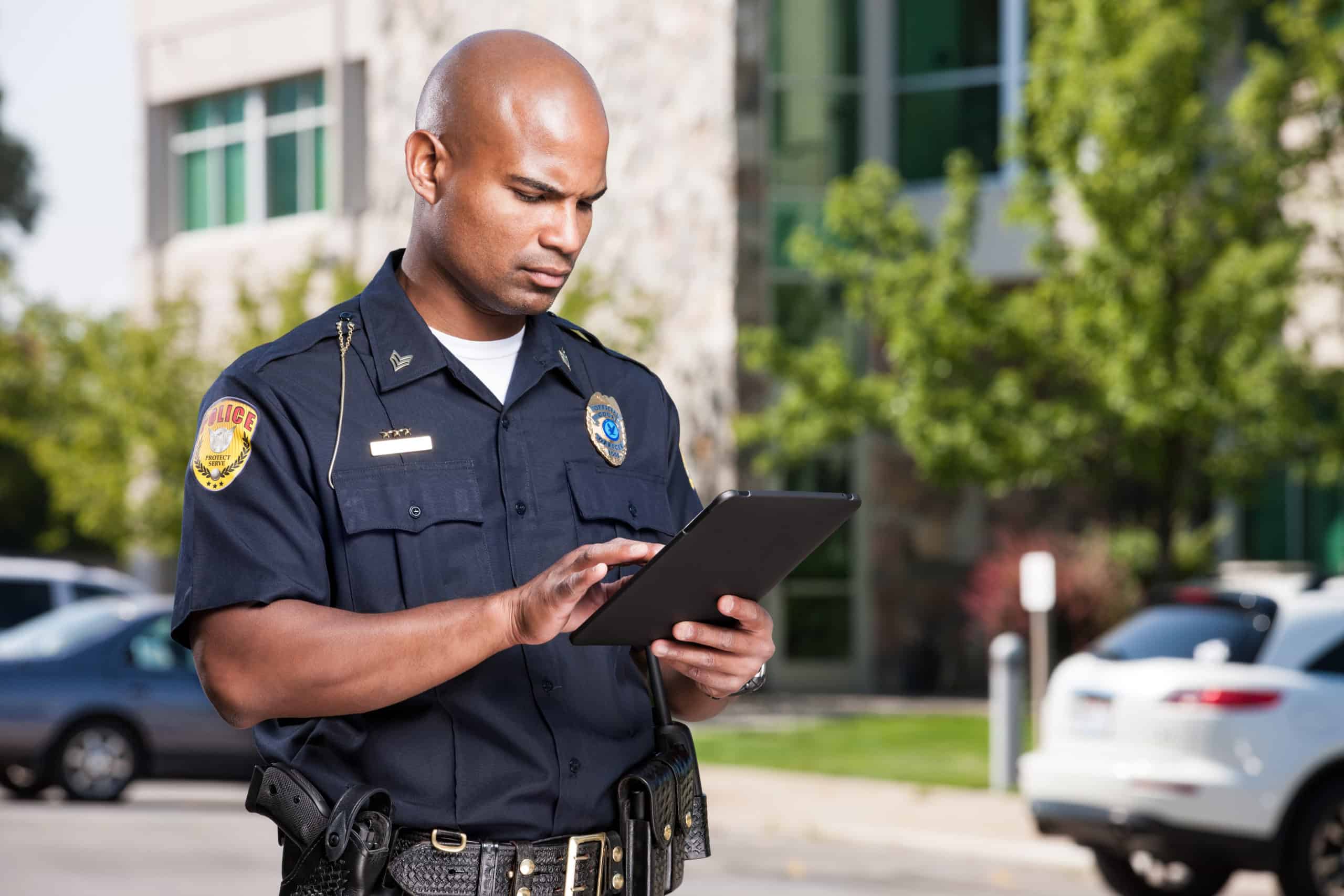 police officer using tablet