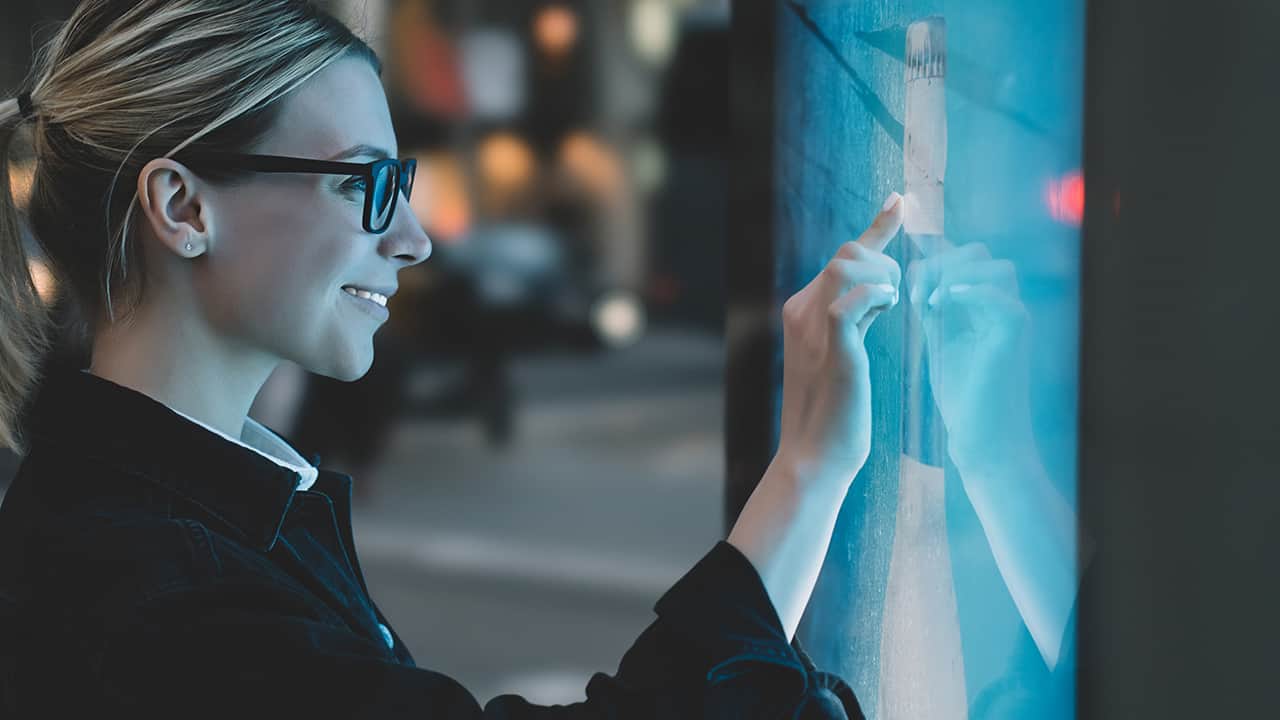 Woman using Newline interactive display