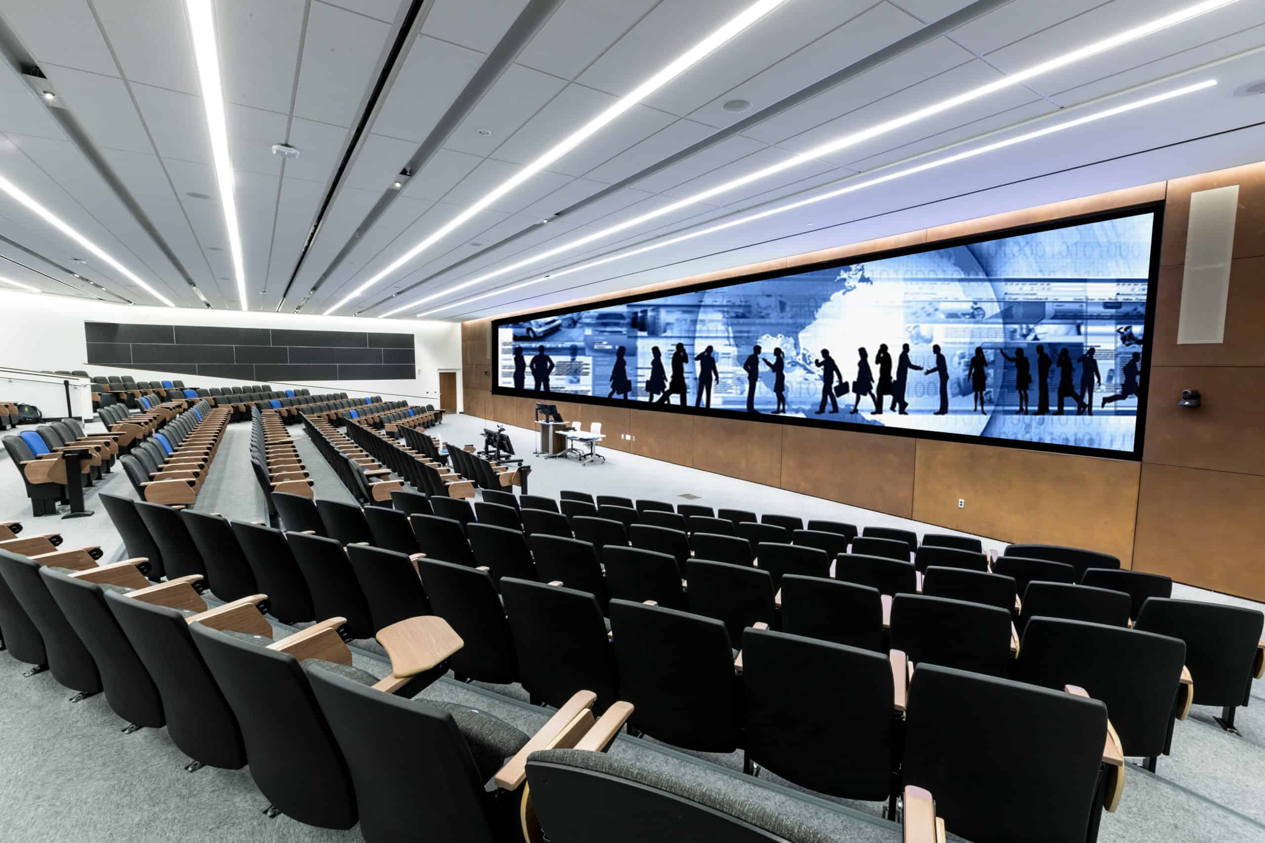 KU School of Business auditorium with large video wall