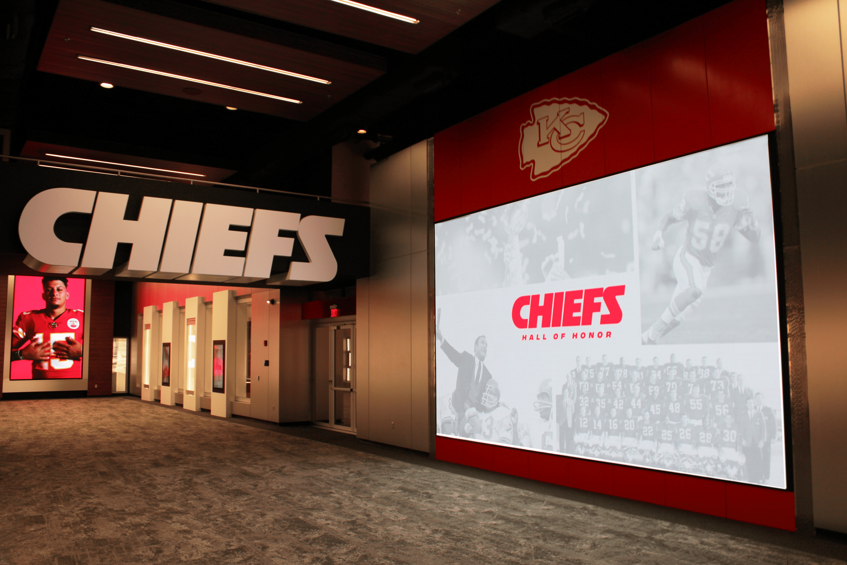 Large video wall with Kansas City Chiefs Hall of Honor logo and visuals