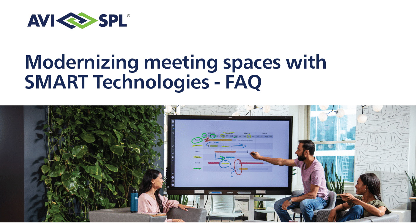 People in a re-designed meeting space with a SMART QX board.