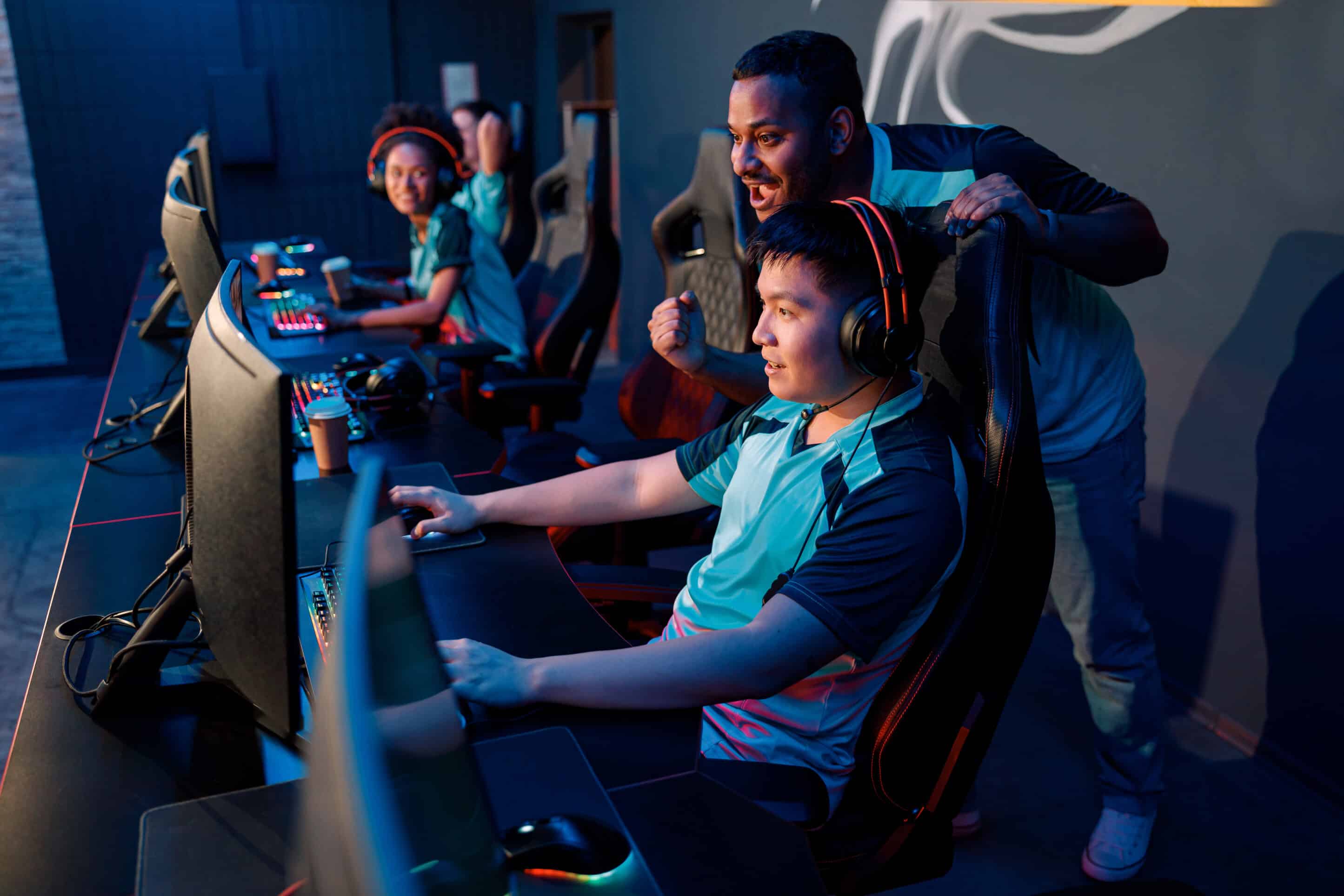 Logitech fund your esports program webcast banner with school team sitting at monitors