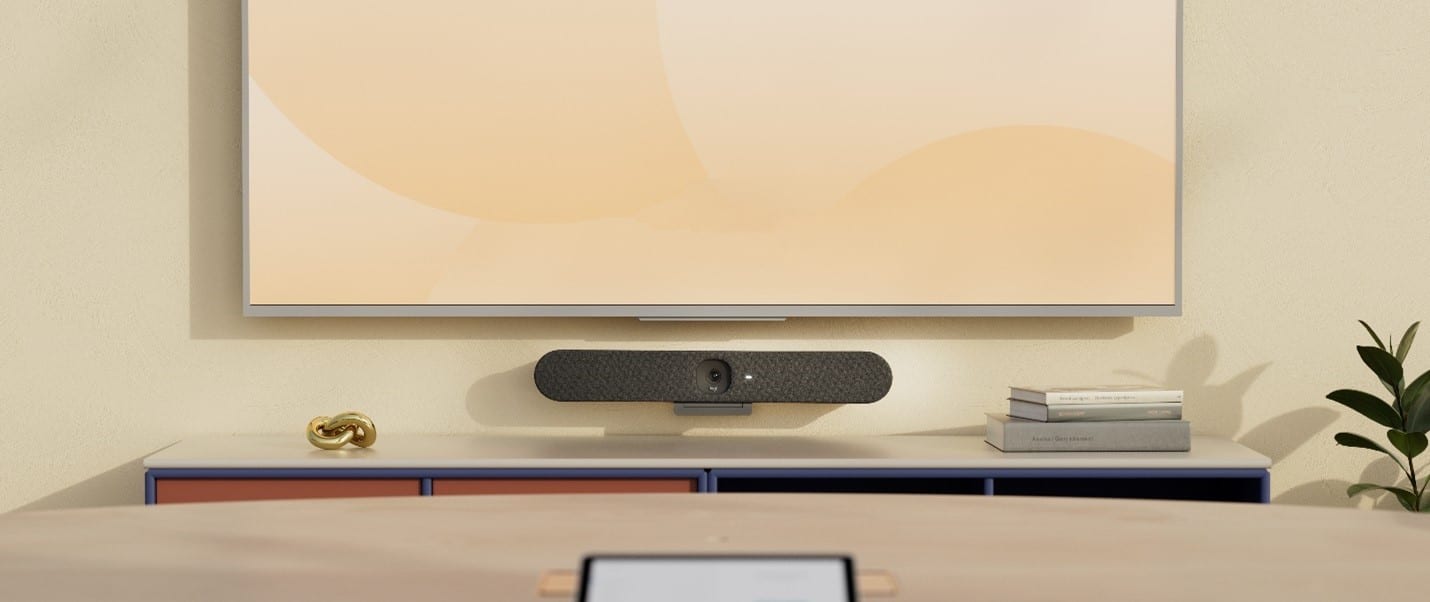 A modern meeting space with sustainable technology from Logitech, including Logitech Rally Bar and Tap