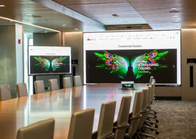 LG conference room with large video wall and display on mobile cart.