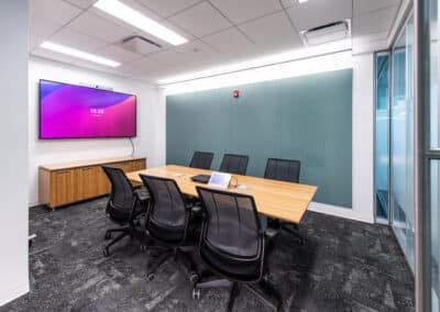 Small meeting space with LG digital displays.