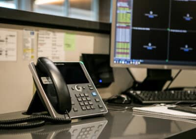 AudioCodes phone set on a desk cubicle