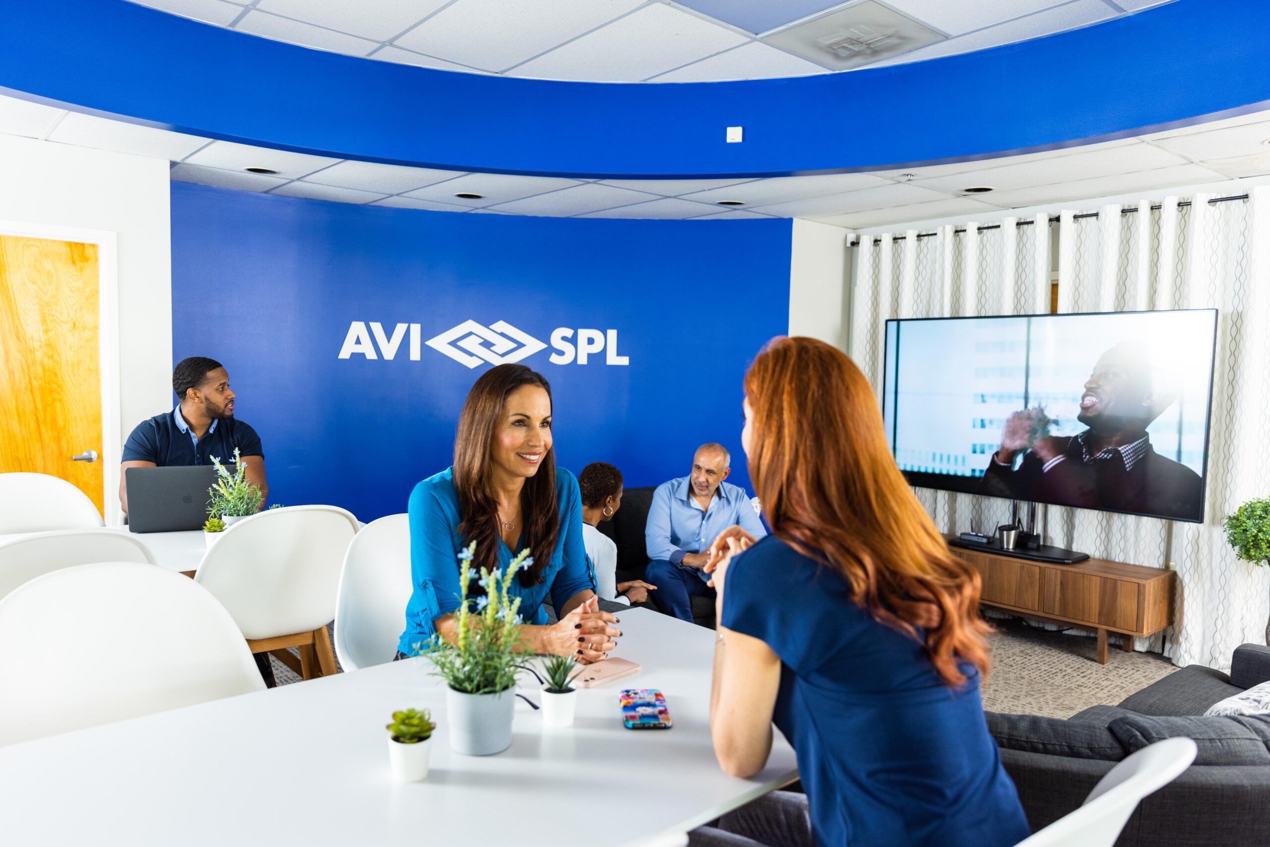 AVI-SPL team members in a collaboration space.