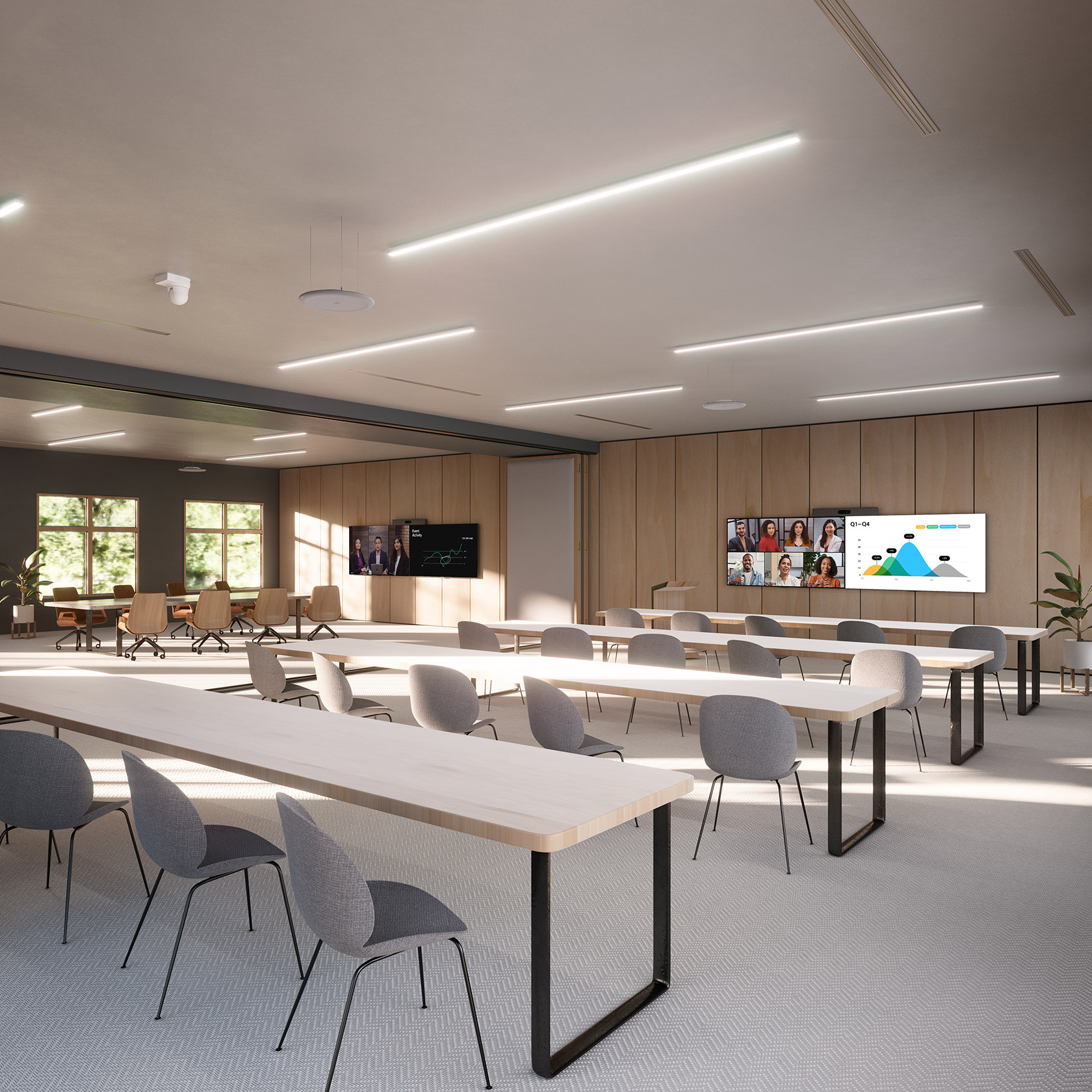 Modern conference room: long wooden tables, gray chairs, wall-mounted screens. Windows and wood panels add warmth; greenery outside.