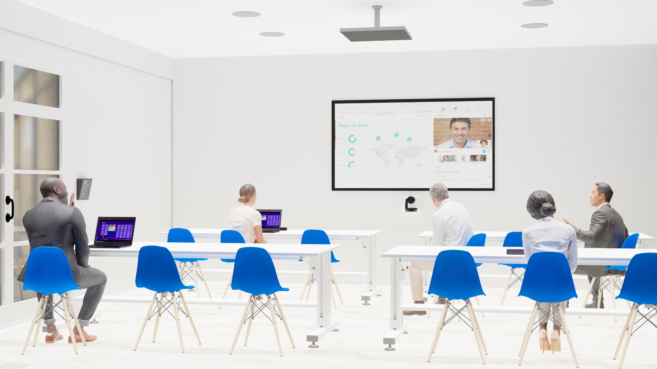 Modern classroom with 6 people at blue chairs, facing a screen with virtual meeting; laptops open, well-lit room, white walls.