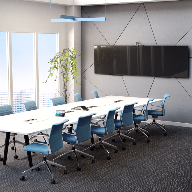 Modern conference room with a long white table, blue chairs, flat-screen TV, plant, and city view from floor-to-ceiling windows.