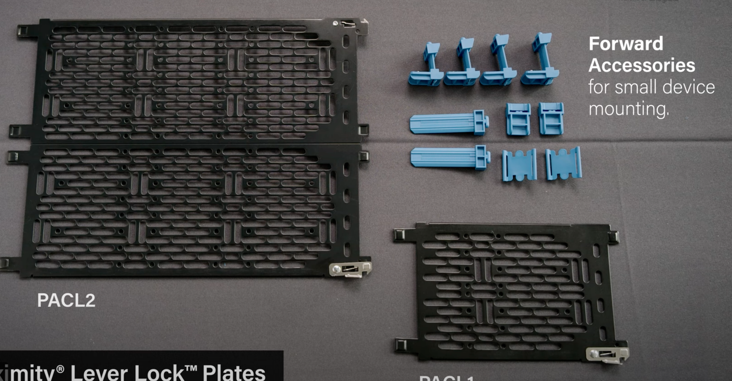 Two black lever lock plates, PACL2 and PACL1, on a gray surface with blue mounting accessories for small device mounting.