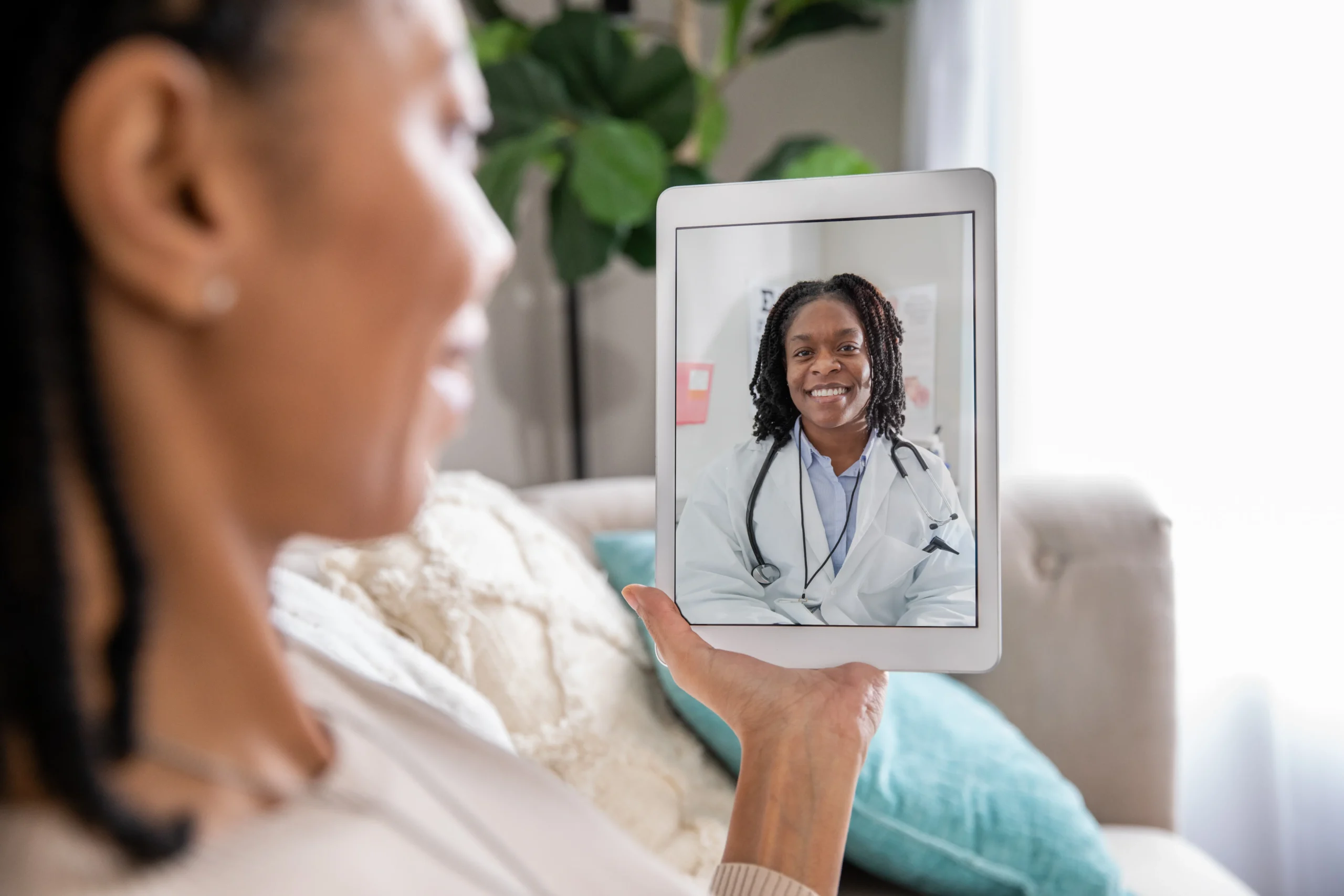 patient using a tablet for a telemedicine video call