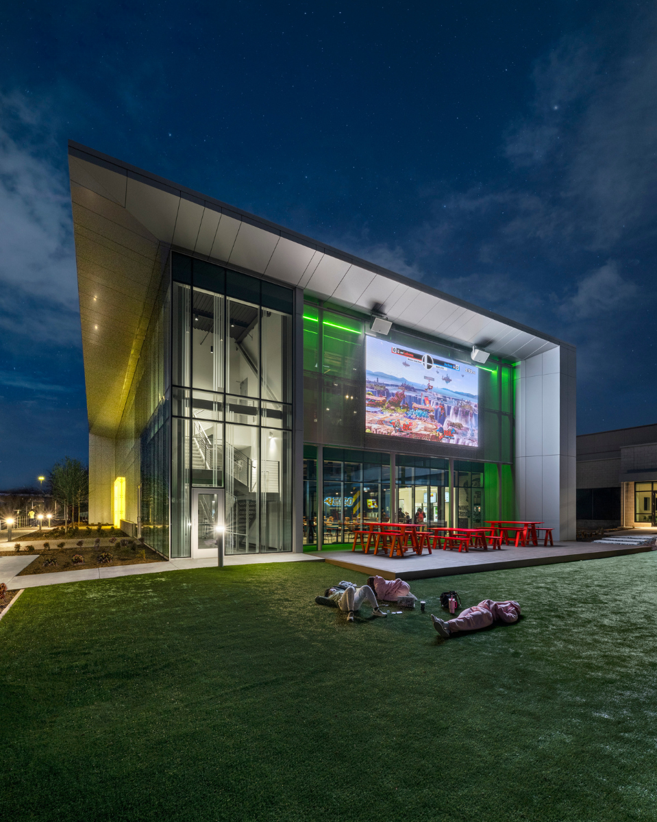 Exterior of Comets LANding at night with video wall on Credit - SMITHGROUP