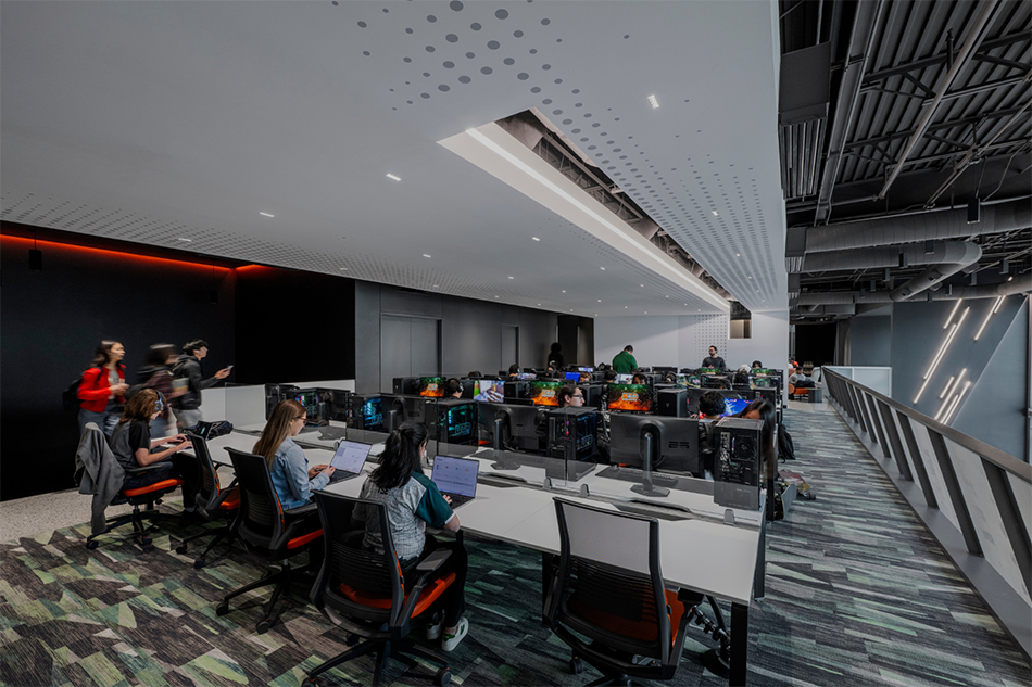Students at gaming stations in Comets LANding Credit - SMITHGROUP