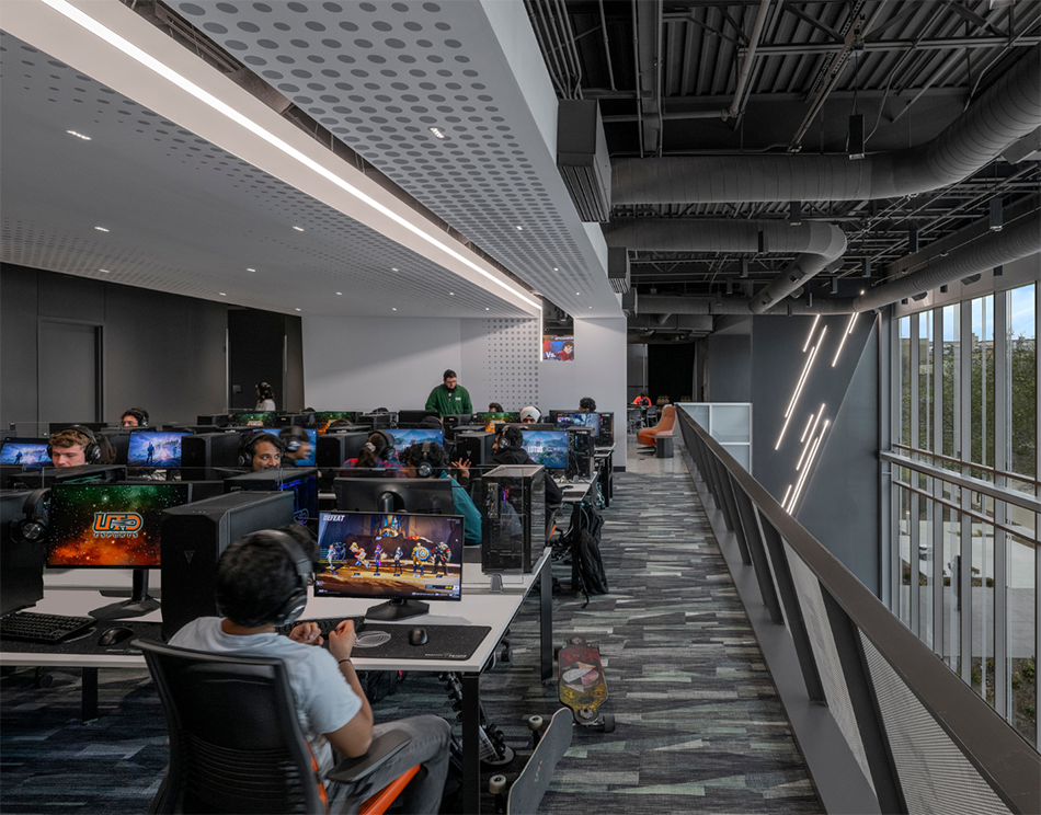 Students gaming at stations on second floor of Comets LANding Credit - SMITHGROUP