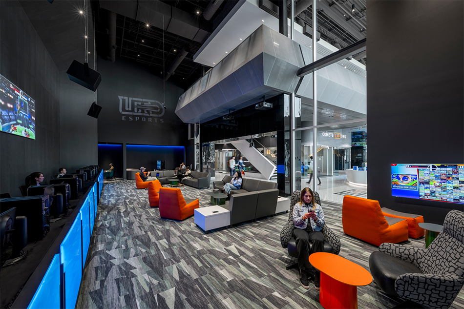 Students gaming lounge with Panasonic digital displays and projectors Credit - SMITHGROUP