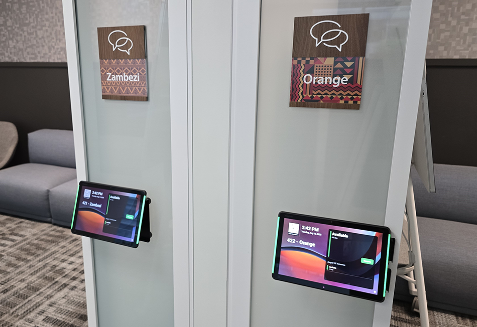 Two IDRC Teams Panels featuring Microsoft Places scheduling information. One panel is for IDRC’s Zambezi room, and the other is for the Orange room.