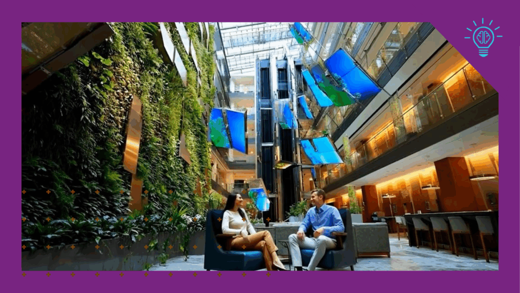 AI generated image of two people seated in a lobby with a wall of greenery beside them and digital signage hanging above.