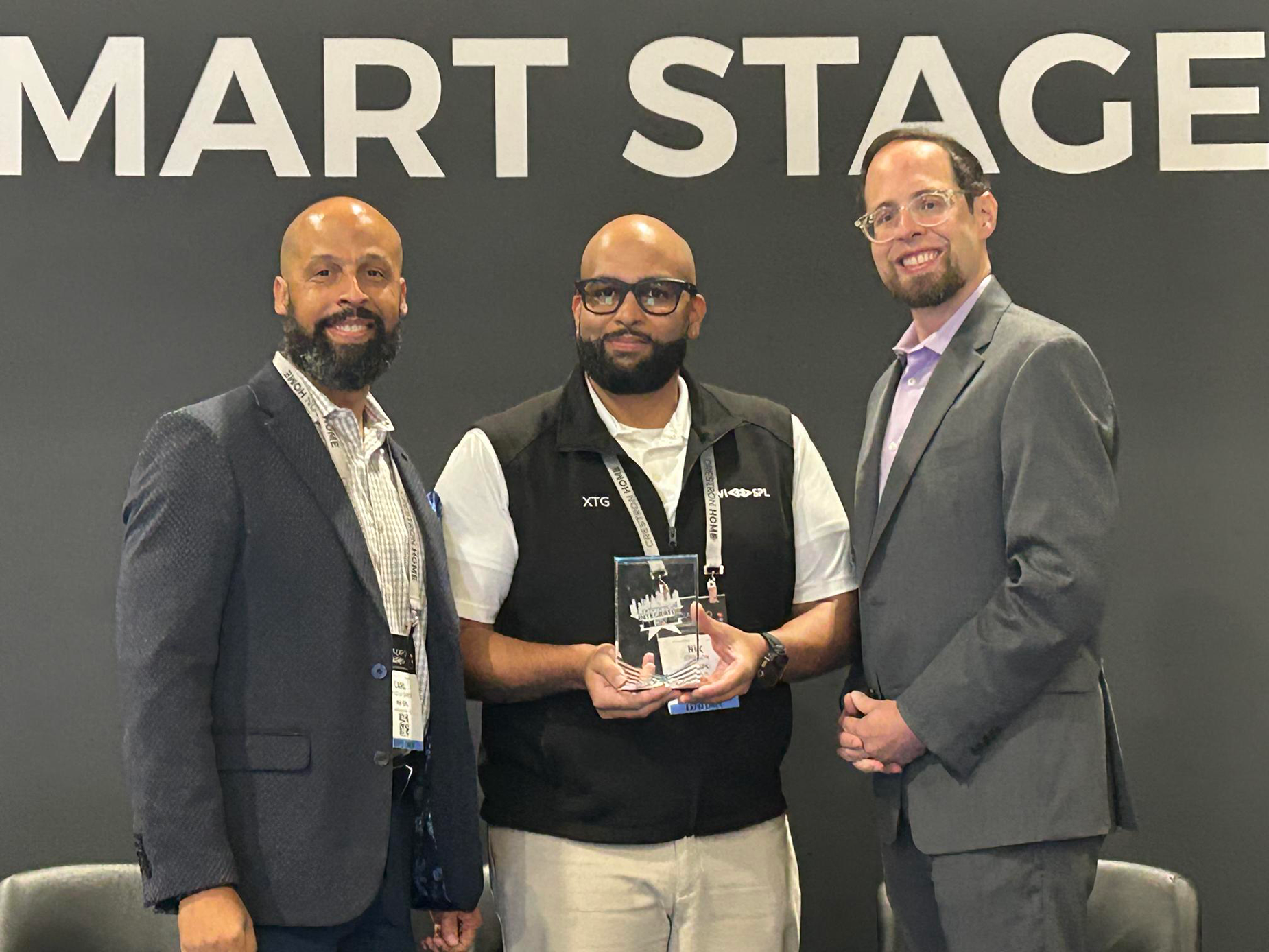 Carl Cruz-La Santa and Nik Johnson accept commercial integrator integration award wins