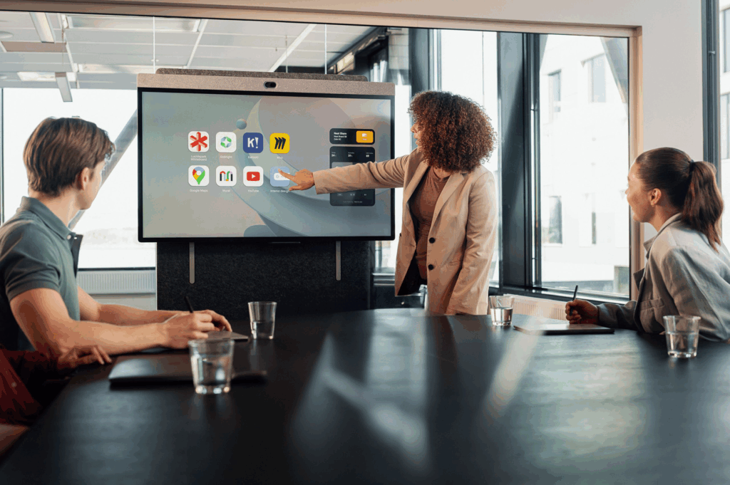 People in a conference room use a Neat Board to run a meeting