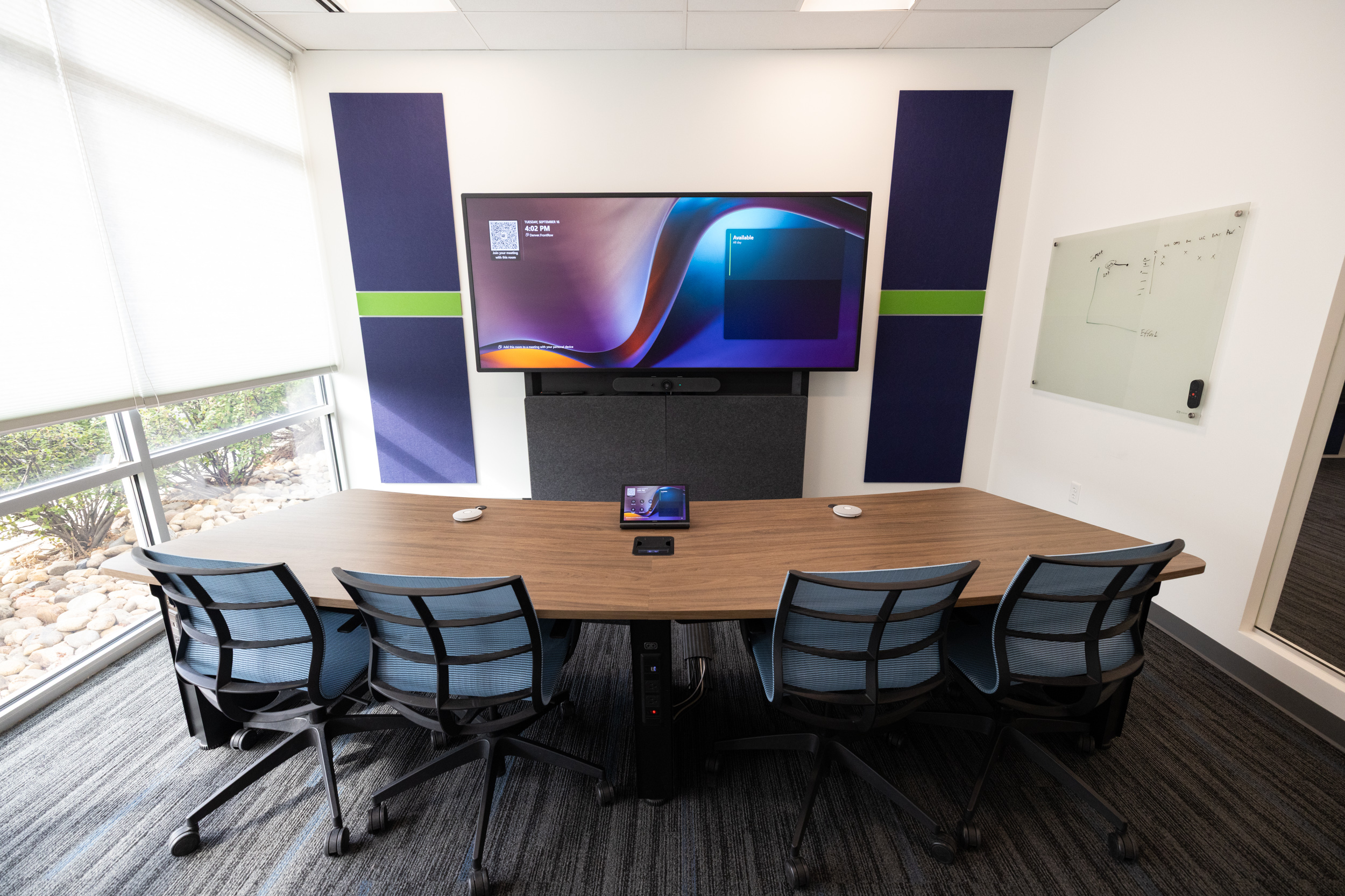 Signature Microsoft Teams Room with arc table and four chairs in Denver
