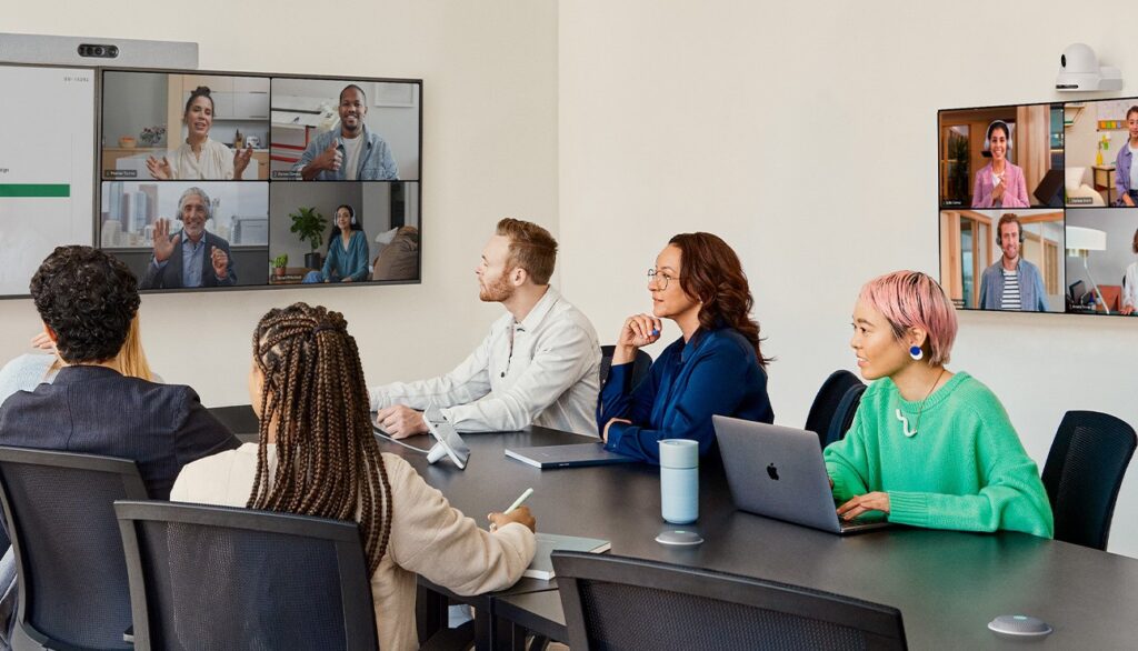 Modern enterprise meeting room equipped with Cisco video conferencing devices and collaborative displays.