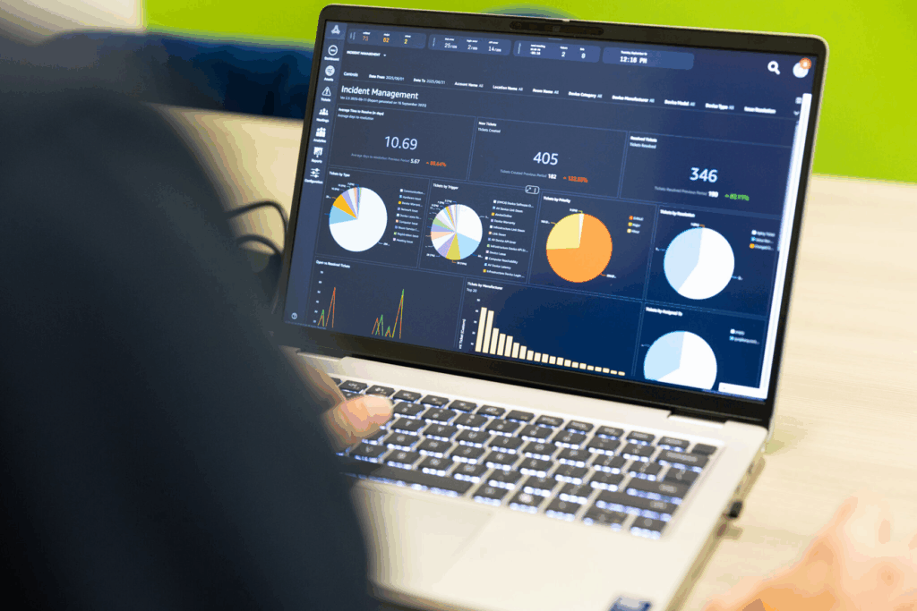 Over-the-shoulder view of a laptop with the AVI-SPL Symphony platform on-screen.