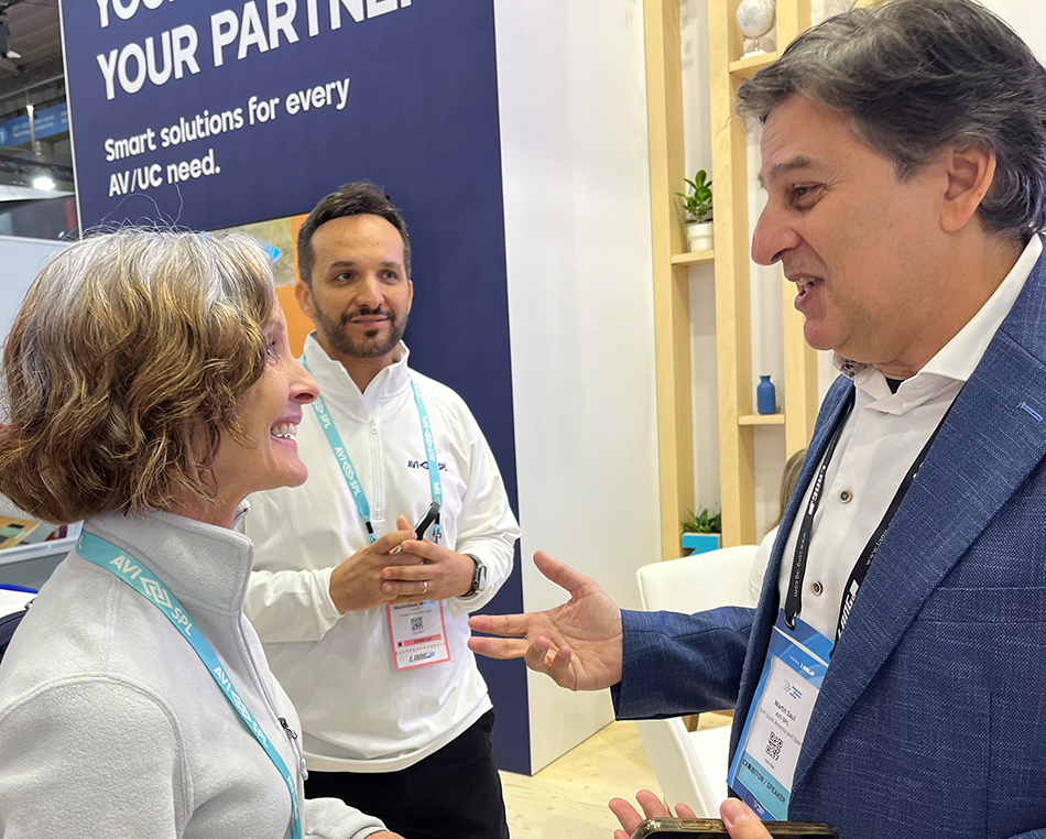 three people enjoying ISE happy hour at AVI-SPL booth