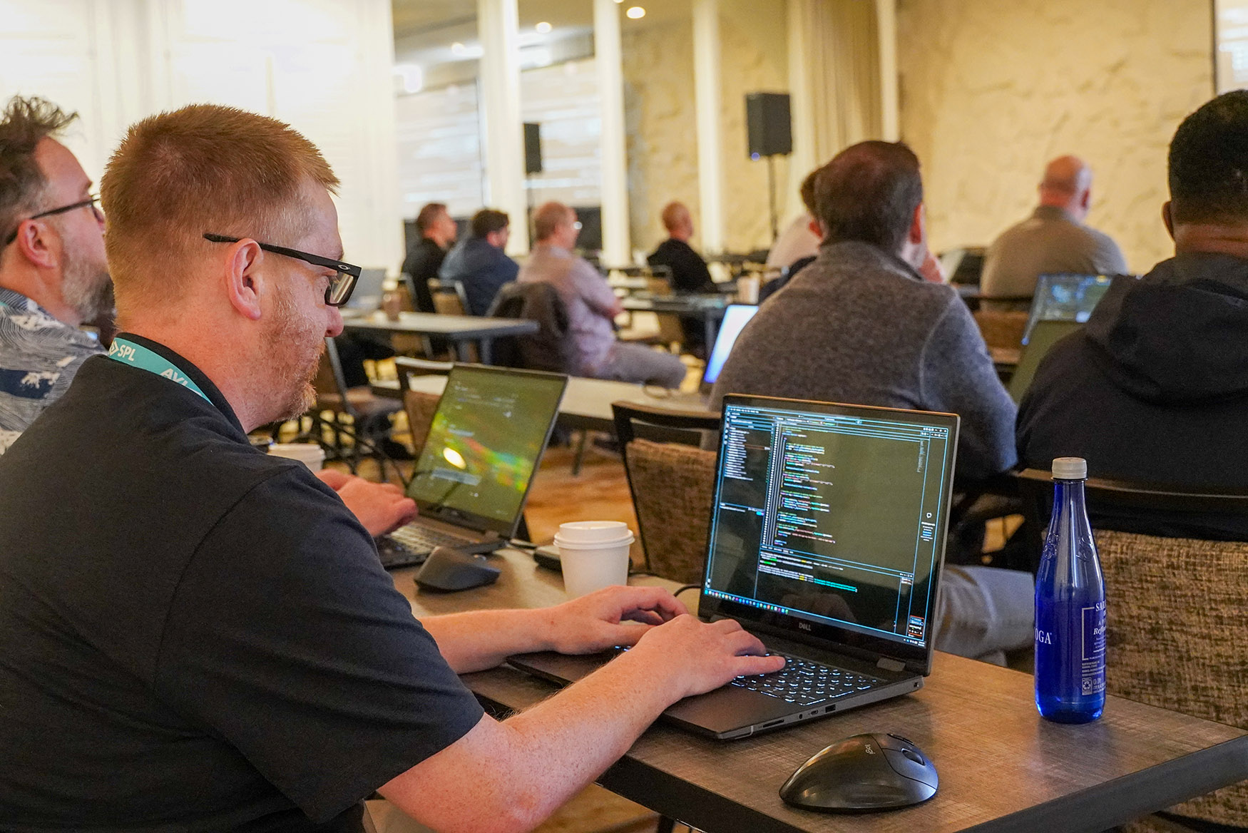 Programmers coding at Techops 2026