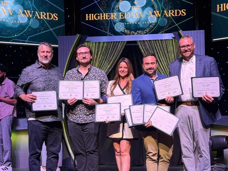 Kevin Schornhorst and team posing with HETMA Awards