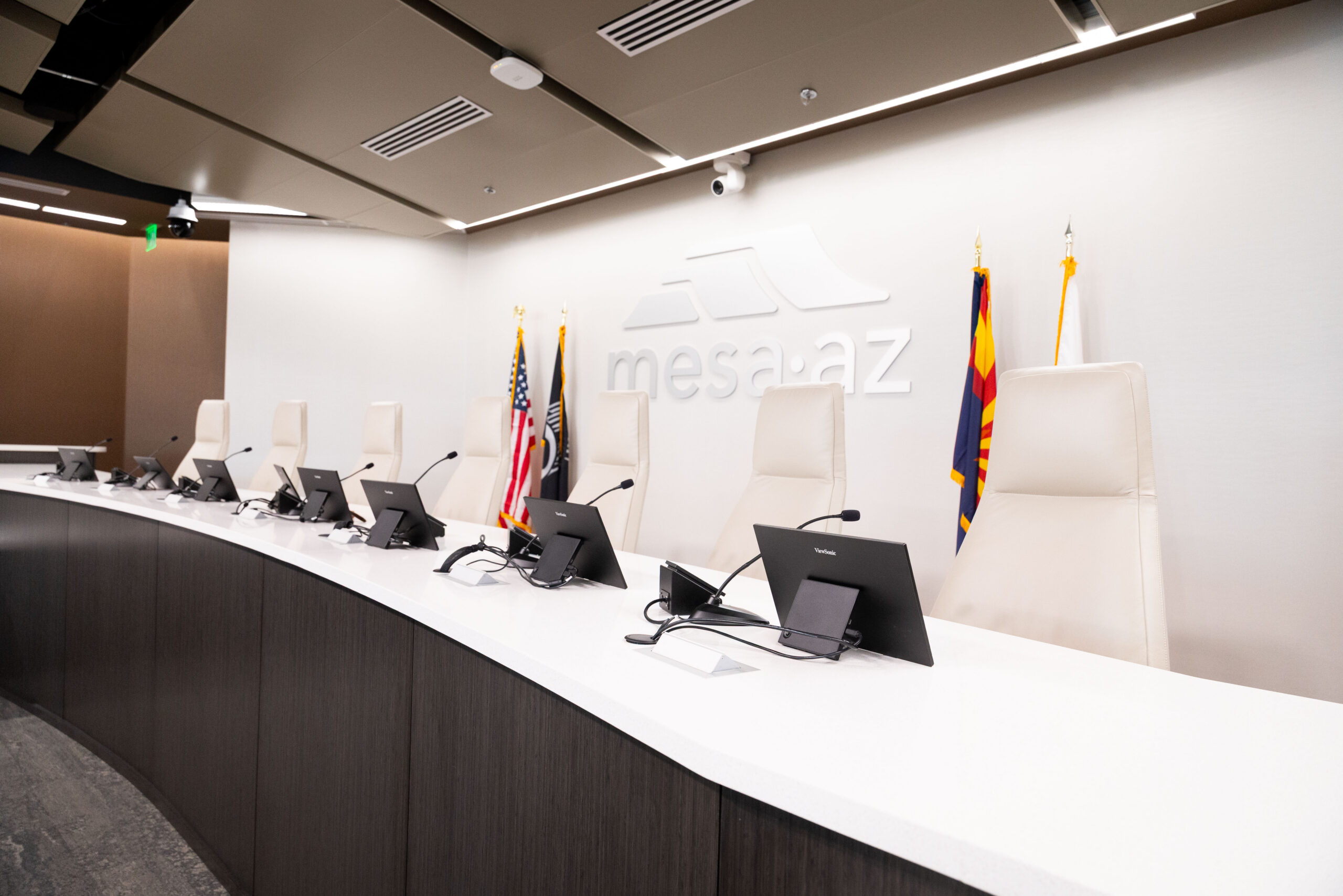 City of Mesa dais with work stations and personal monitors, microphones, and voting panels at each.